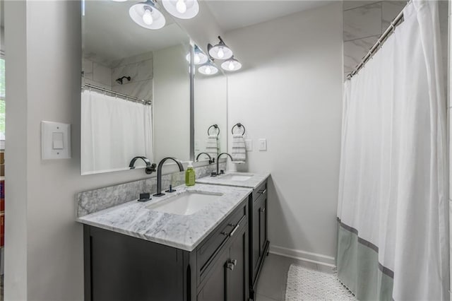 10100 E Sheley Rd, Independence, MO 64052 - full bath featuring double vanity, tile patterned flooring, a shower with shower curtain, and baseboards