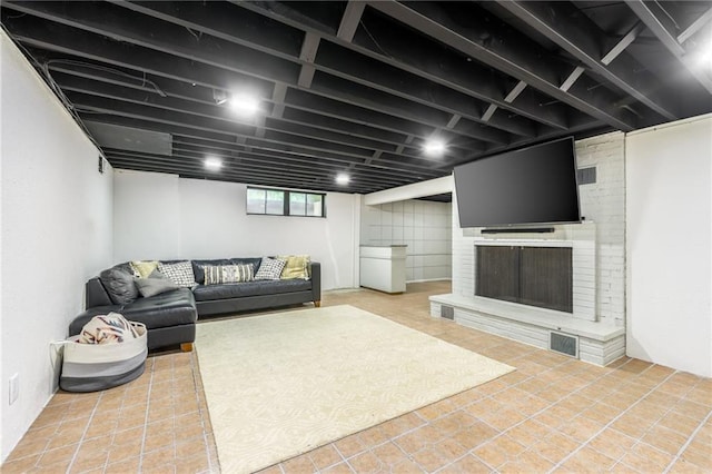 10100 E Sheley Rd, Independence, MO 64052 - living room featuring tile patterned floors and a fireplace