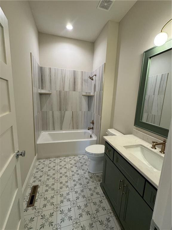 22428 W 90th Ter, Lenexa, KS 66227 - bathroom featuring toilet, vanity, washtub / shower combination, tile patterned floors, and recessed lighting