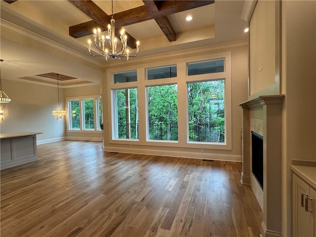 22428 W 90th Ter, Lenexa, KS 66227 - unfurnished living room featuring a chandelier, coffered ceiling, a fireplace, ornamental molding, and baseboards