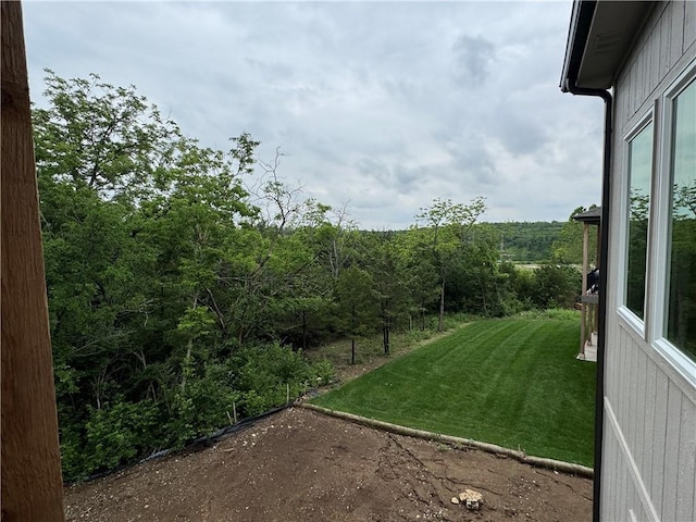 22428 W 90th Ter, Lenexa, KS 66227 - view of grassy yard with a forest view