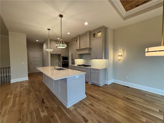 22428 W 90th Ter, Lenexa, KS 66227 - kitchen with a sink, baseboards, tasteful backsplash, dark wood finished floors, and recessed lighting