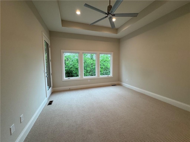 22428 W 90th Ter, Lenexa, KS 66227 - empty room featuring baseboards, a ceiling fan, light carpet, recessed lighting, and a tray ceiling