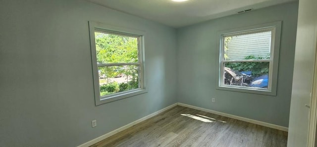 2918 S 52nd Ter, Kansas City, KS 66106 - spare room with baseboards and wood finished floors