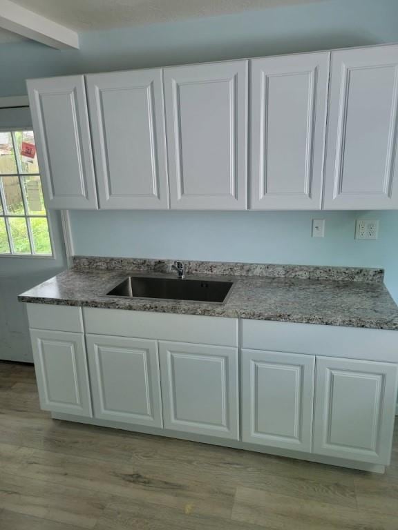 2918 S 52nd Ter, Kansas City, KS 66106 - detailed view of a sink and wood finished floors
