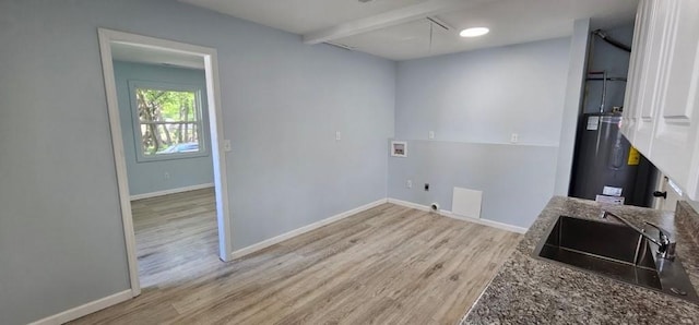 2918 S 52nd Ter, Kansas City, KS 66106 - laundry area featuring hookup for a washing machine, electric dryer hookup, electric water heater, attic access, and wood finished floors