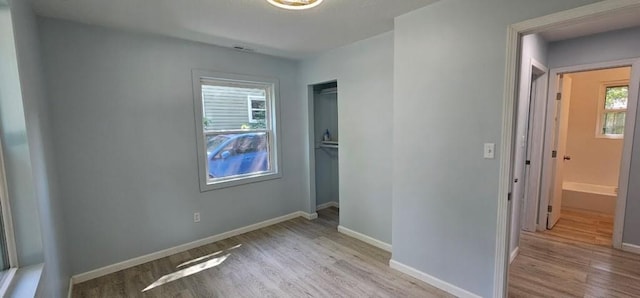 2918 S 52nd Ter, Kansas City, KS 66106 - unfurnished bedroom with wood finished floors, a closet, and baseboards