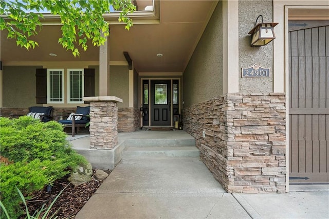 24901 W 91st Pl, Lenexa, KS 66227 - entrance to property with stone siding, stucco siding, and a porch
