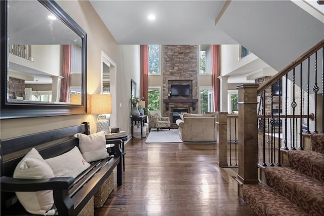 24901 W 91st Pl, Lenexa, KS 66227 - living area featuring dark wood-style floors, a fireplace, stairway, and recessed lighting