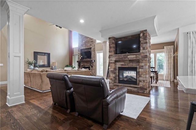 24901 W 91st Pl, Lenexa, KS 66227 - living area featuring a stone fireplace, dark wood-style floors, ornate columns, and recessed lighting