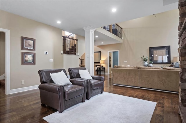 24901 W 91st Pl, Lenexa, KS 66227 - living room with ornate columns, baseboards, wood finished floors, recessed lighting, and stairway