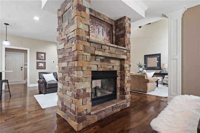 24901 W 91st Pl, Lenexa, KS 66227 - living room with wood finished floors, a fireplace, decorative columns, baseboards, and recessed lighting