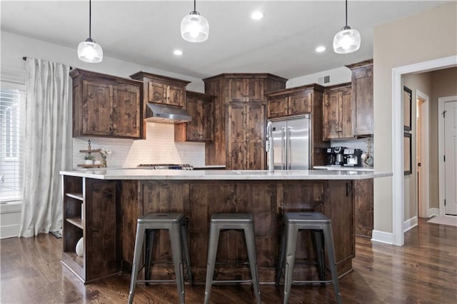 24901 W 91st Pl, Lenexa, KS 66227 - kitchen with stainless steel built in fridge, dark wood-type flooring, light countertops, decorative backsplash, and recessed lighting