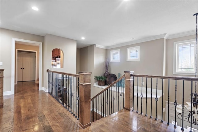 24901 W 91st Pl, Lenexa, KS 66227 - hallway featuring an upstairs landing, wood finished floors, healthy amount of natural light, recessed lighting, and ornamental molding