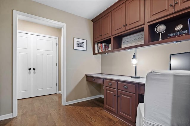 24901 W 91st Pl, Lenexa, KS 66227 - home office with built in study area, baseboards, and dark wood-style floors