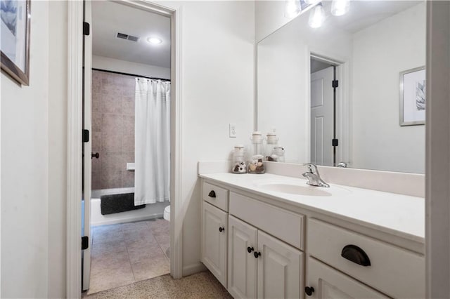 24901 W 91st Pl, Lenexa, KS 66227 - bathroom with vanity, toilet, shower / bath combo with shower curtain, and speckled floor