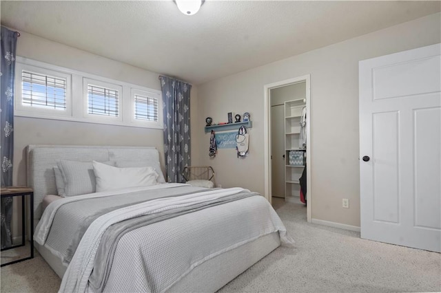 24901 W 91st Pl, Lenexa, KS 66227 - bedroom with light carpet, a walk in closet, a closet, and baseboards