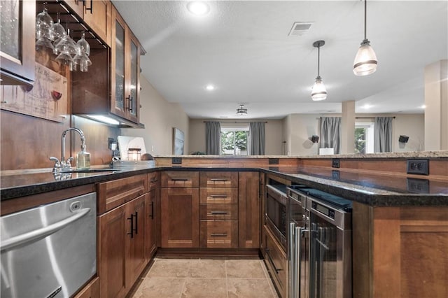 24901 W 91st Pl, Lenexa, KS 66227 - kitchen with appliances with stainless steel finishes, a sink, wine cooler, dark stone countertops, and brown cabinetry