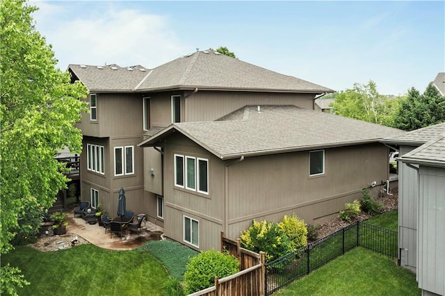 24901 W 91st Pl, Lenexa, KS 66227 - back of property with roof with shingles and a patio area