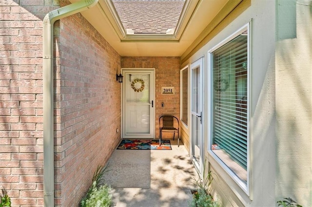 2051 W 139th Ter, Leawood, KS 66224 - property entrance featuring brick siding and a shingled roof