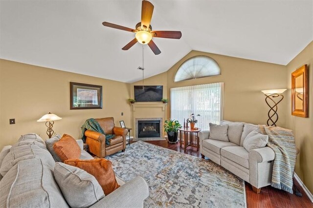 2051 W 139th Ter, Leawood, KS 66224 - living area with ceiling fan, a fireplace with flush hearth, dark wood-style flooring, and high vaulted ceiling