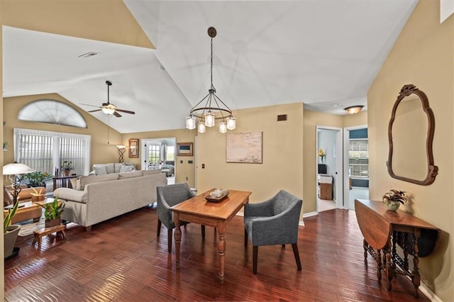 2051 W 139th Ter, Leawood, KS 66224 - dining space with ceiling fan, dark wood-style floors, vaulted ceiling, and a chandelier