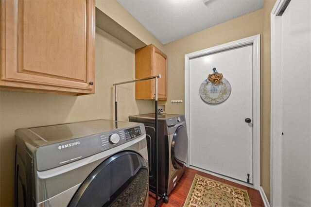 2051 W 139th Ter, Leawood, KS 66224 - washroom featuring washer and clothes dryer, cabinet space, and dark wood-style flooring