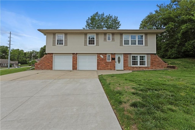 210 Murray Rd, Lees Summit, MO 64081 - view of front of house featuring concrete driveway, brick siding, a front lawn, and an attached garage