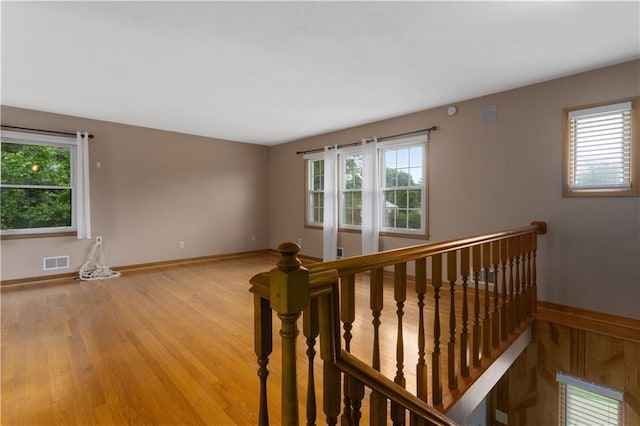 210 Murray Rd, Lees Summit, MO 64081 - spare room featuring healthy amount of natural light, baseboards, and light wood-type flooring