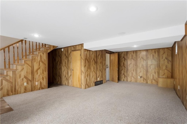 210 Murray Rd, Lees Summit, MO 64081 - finished basement featuring carpet flooring, wooden walls, stairway, and recessed lighting