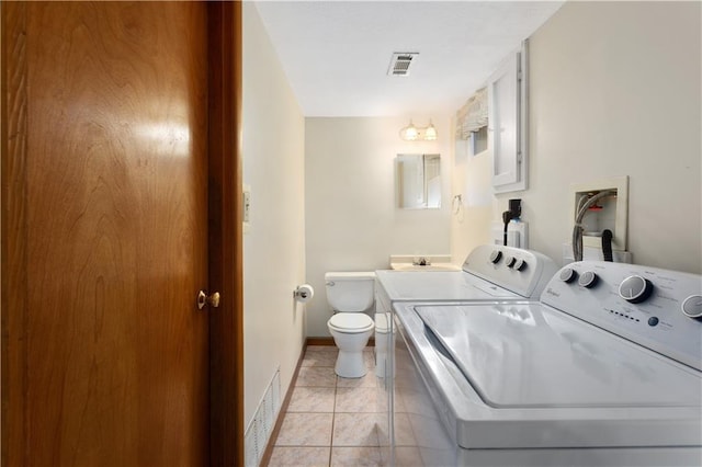 210 Murray Rd, Lees Summit, MO 64081 - bathroom featuring toilet, baseboards, vanity, tile patterned flooring, and washer and dryer