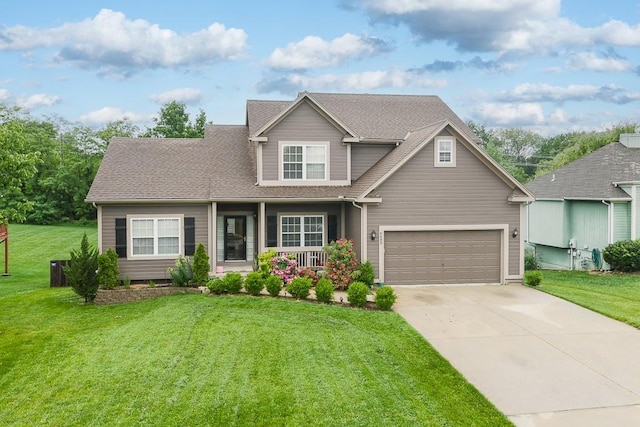 4422 N 122nd Ter, Kansas City, KS 66109 - view of front of home with a porch, concrete driveway, a front lawn, and roof with shingles