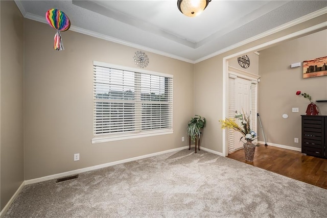 4422 N 122nd Ter, Kansas City, KS 66109 - spare room with carpet floors, baseboards, a raised ceiling, and crown molding
