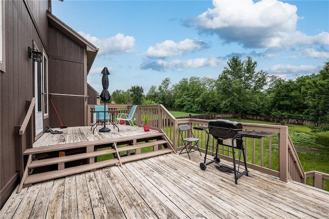 4422 N 122nd Ter, Kansas City, KS 66109 - wooden deck featuring outdoor dining area and view of wooded area