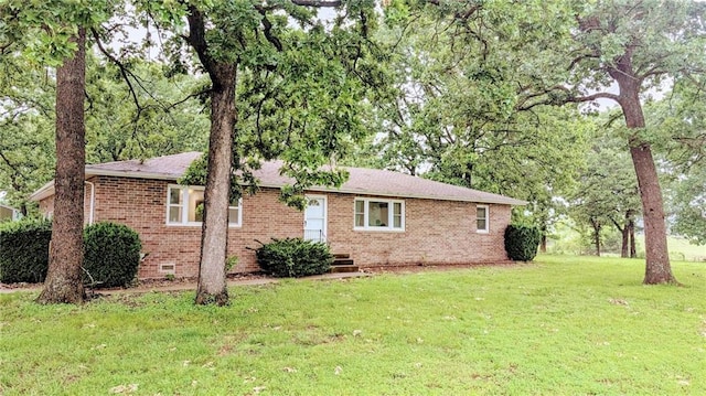 9550B S 325th Rd, El Dorado Springs, MO 64744 - view of front of property featuring brick siding, a front lawn, and crawl space