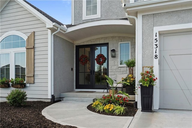 15318 W 172nd Pl, Olathe, KS 66062 - property entrance featuring stucco siding and a garage