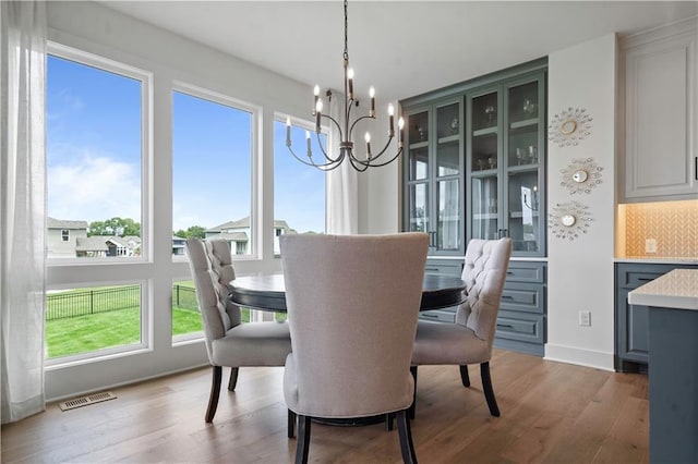 15318 W 172nd Pl, Olathe, KS 66062 - dining room with a chandelier and wood finished floors