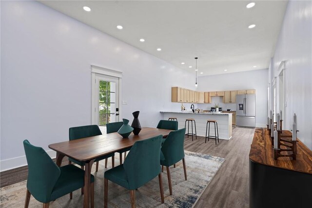 1003 Commercial St, Atchison, KS 66002 - dining area with light wood-style flooring, recessed lighting, and baseboards