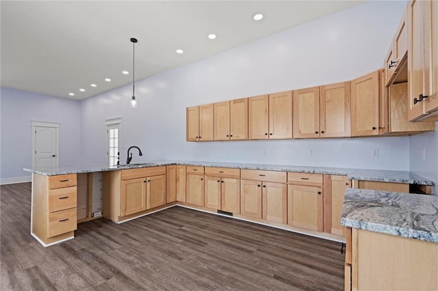 1003 Commercial St, Atchison, KS 66002 - kitchen featuring light brown cabinetry, a sink, dark wood-type flooring, a peninsula, and recessed lighting