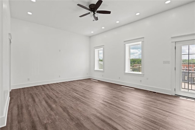 1003 Commercial St, Atchison, KS 66002 - empty room with wood finished floors, a ceiling fan, recessed lighting, and baseboards
