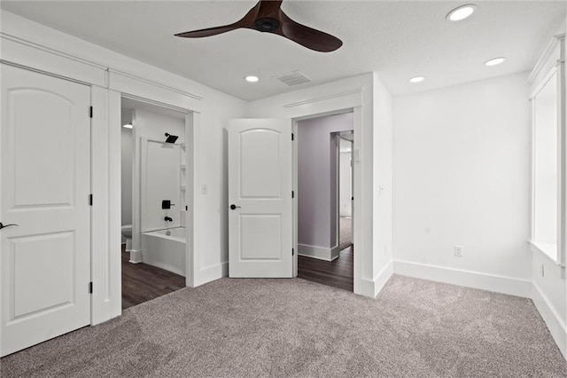 1003 Commercial St, Atchison, KS 66002 - unfurnished bedroom featuring carpet floors, baseboards, ceiling fan, and recessed lighting