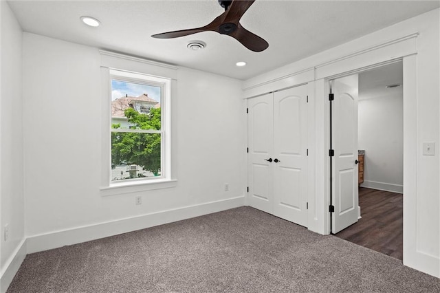 1003 Commercial St, Atchison, KS 66002 - unfurnished bedroom featuring dark carpet, baseboards, a closet, recessed lighting, and a ceiling fan