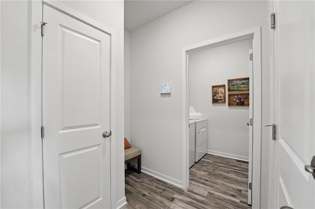 7708 NE 107th Ter, Kansas City, MO 64157 - hallway featuring washer and clothes dryer, dark wood finished floors, and baseboards