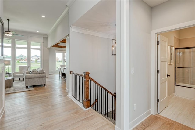 17162 S Hall St, Olathe, KS 66062 - hall featuring an upstairs landing, light wood-style floors, ornamental molding, baseboards, and recessed lighting