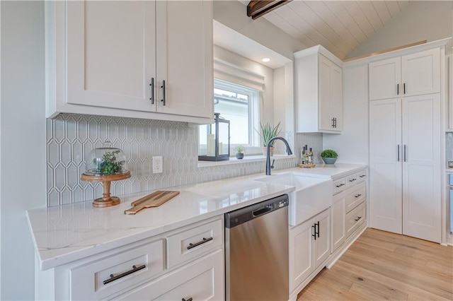 17162 S Hall St, Olathe, KS 66062 - kitchen with stainless steel dishwasher, a sink, white cabinets, backsplash, and lofted ceiling