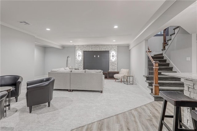 17162 S Hall St, Olathe, KS 66062 - living room with light wood-style floors, stairs, recessed lighting, crown molding, and baseboards