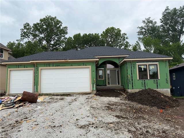 17162 S Hall St, Olathe, KS 66062 - view of front of house with a garage and driveway