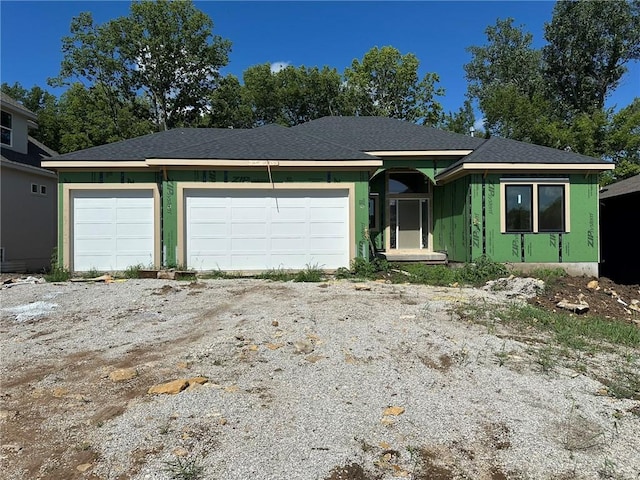 17162 S Hall St, Olathe, KS 66062 - view of front facade featuring an attached garage and stucco siding
