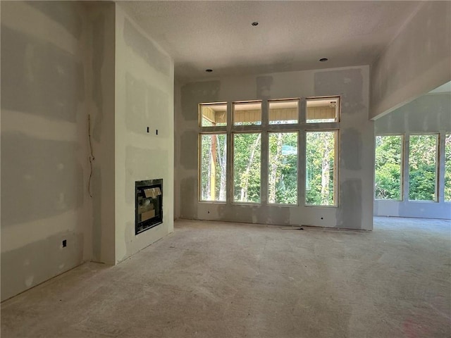 17162 S Hall St, Olathe, KS 66062 - unfurnished living room with a glass covered fireplace