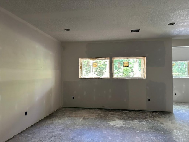 17162 S Hall St, Olathe, KS 66062 - unfurnished room with a textured ceiling and concrete flooring